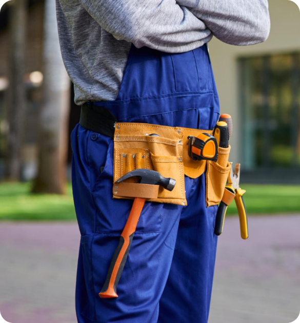 Contractor wearing blue work uniform with tool belt and construction tools for roofing, plumbing, HVAC, and home services